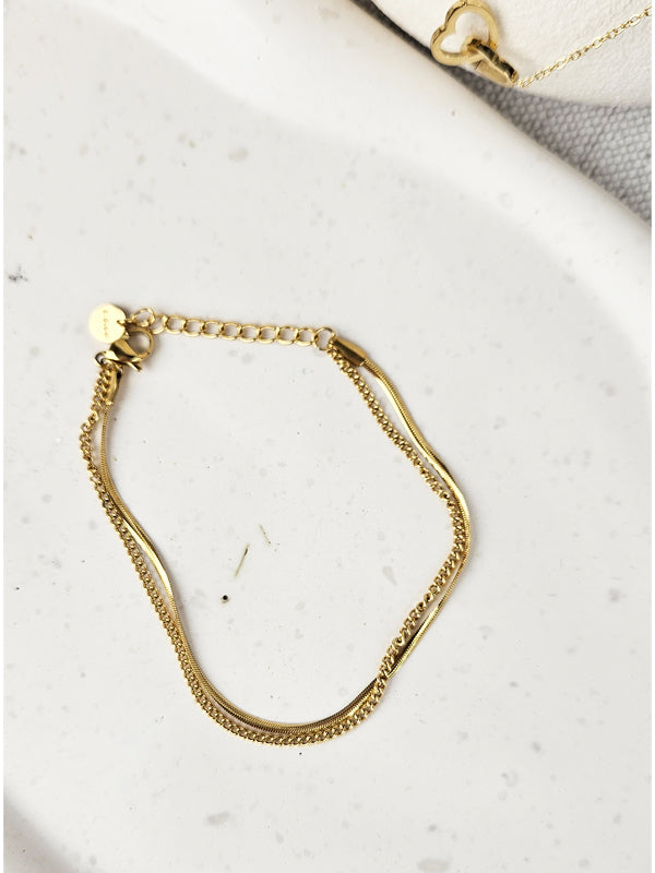 Pulsera de acero inoxidable Double Chains dorada.