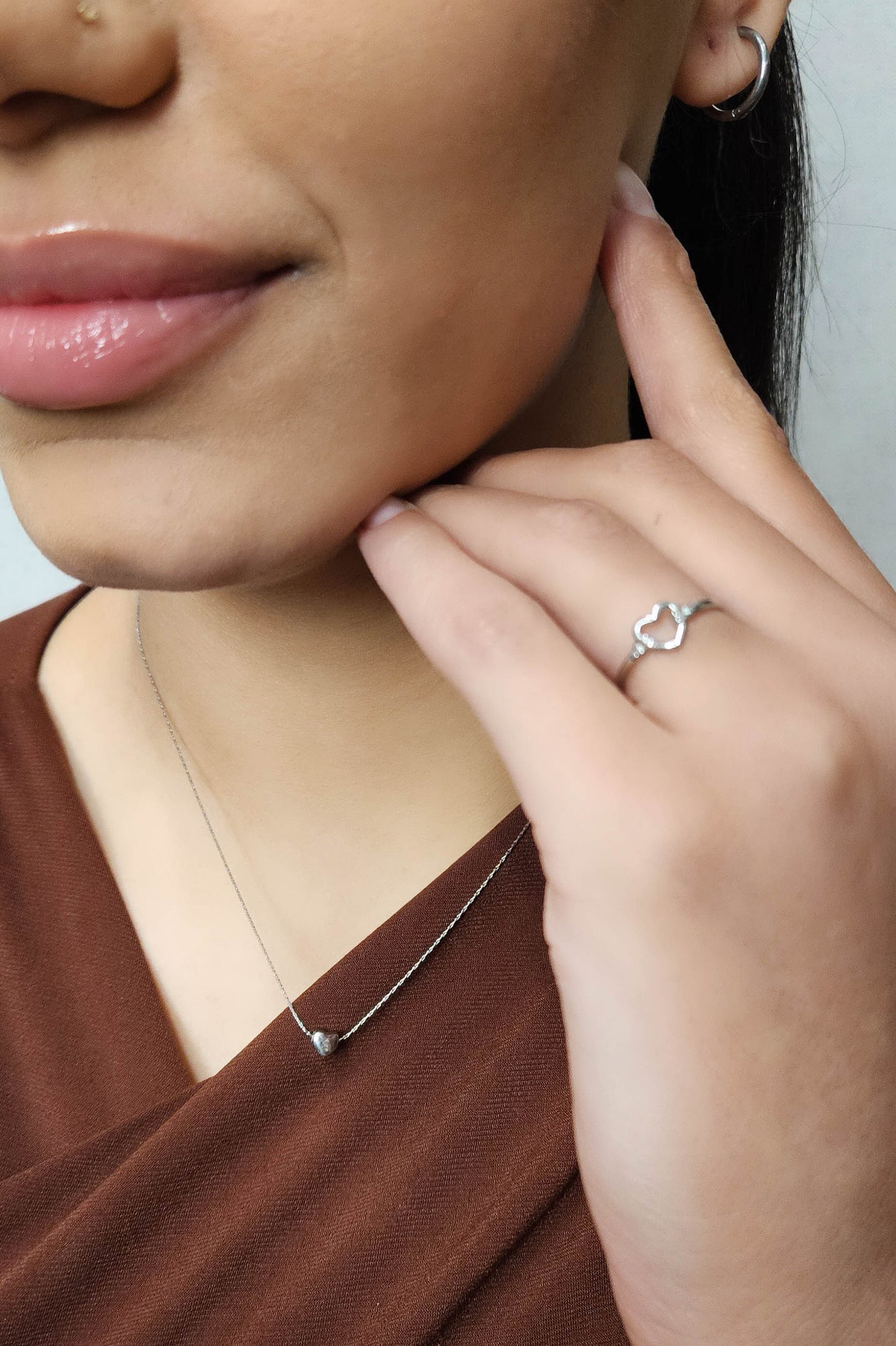 Cadena de acero inoxidable con un solo corazón de plata